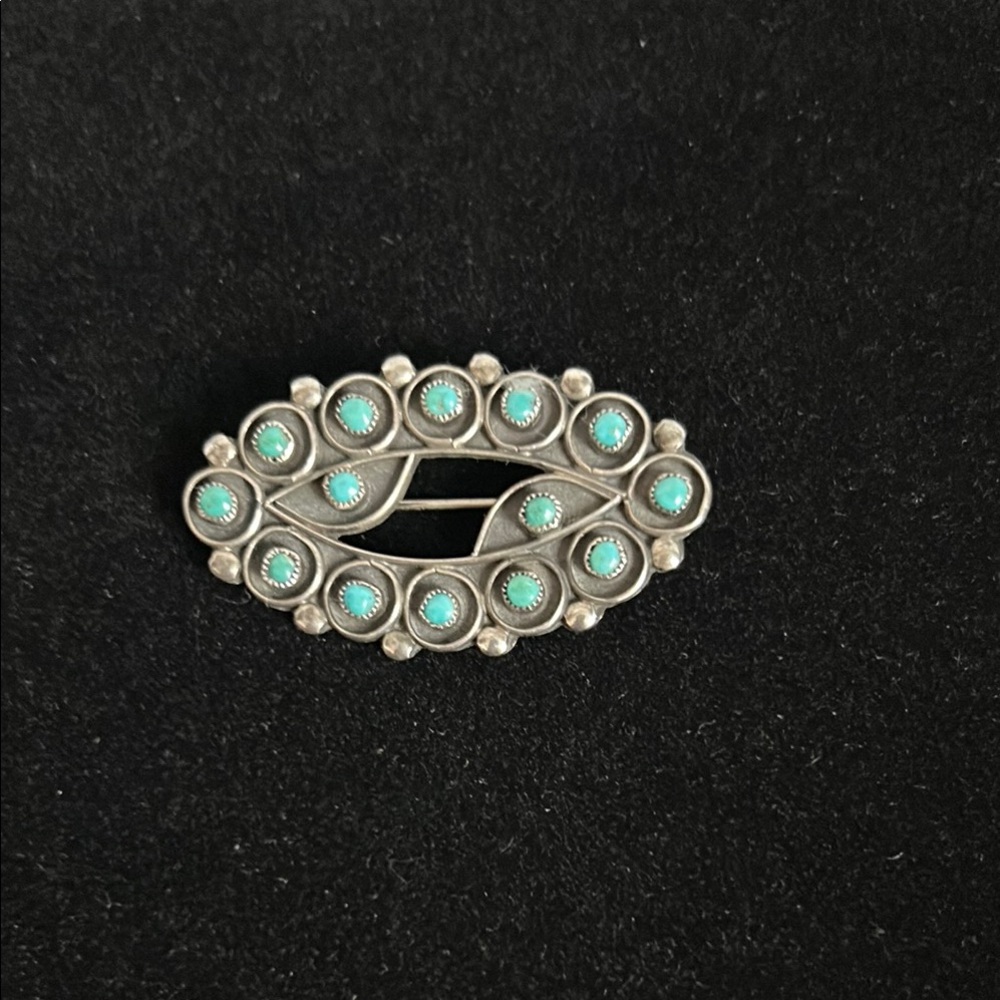 Native American sterling silver/turquoise brooch.